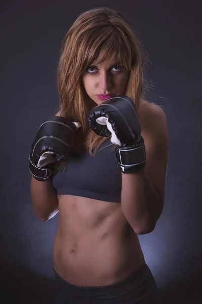 Fitness girl with boxing gloves