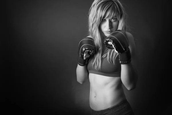 Fitness girl with boxing gloves