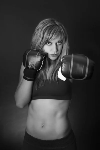 Fitness girl with boxing gloves