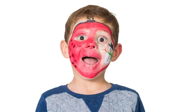 Lovely adorable kid with paintings on his face as a bauble with Stock Photo