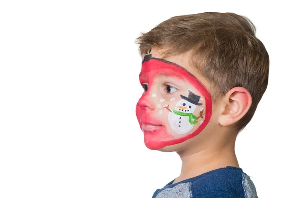 Lovely adorable kid with paintings on his face as a bauble with Royalty Free Stock Images