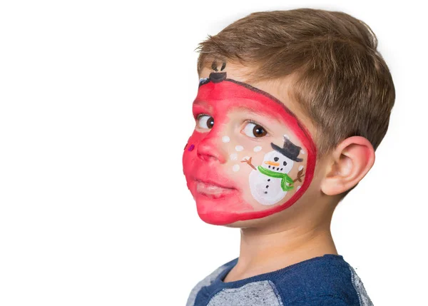 Lovely adorable kid with paintings on his face as a bauble with Royalty Free Stock Images