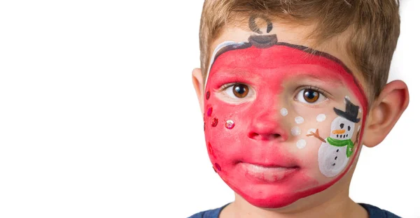 Lovely adorable kid with paintings on his face as a bauble with Stock Picture