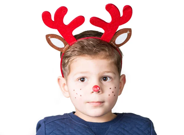 Lovely adorable kid with paintings on his face for Christmas Stock Photo