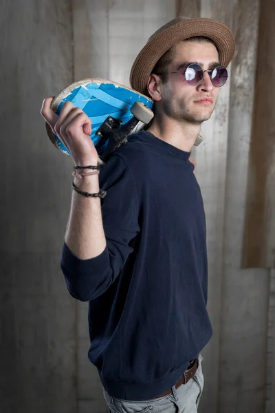 Young fashion guy with a skateboard — Stock Photo, Image