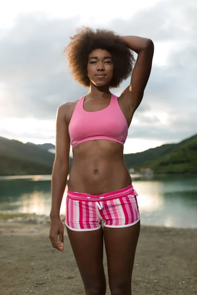 afro woman athlete in park