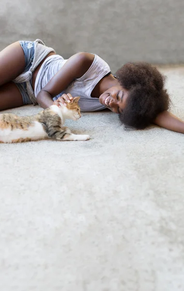 afro woman with cat