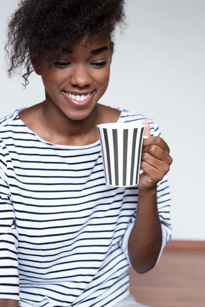 afro woman with coffee cup