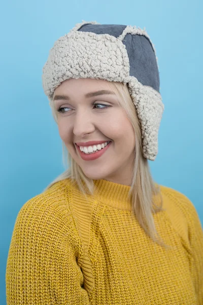 Woman in a woolly winter hat with earflaps — Stock Photo, Image