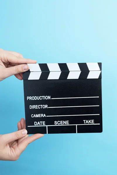 Woman holding movie clapper — Stock Photo, Image