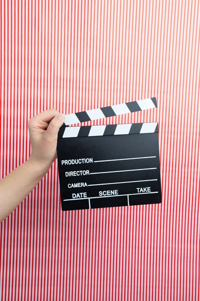 Woman holding movie clapper — Stock Photo, Image