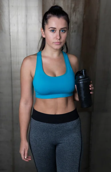 Fitness woman with whey shaker — Stock Photo, Image