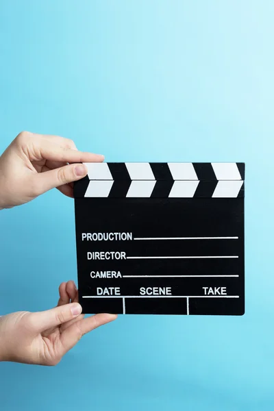 Woman holding movie clapper — Stock Photo, Image