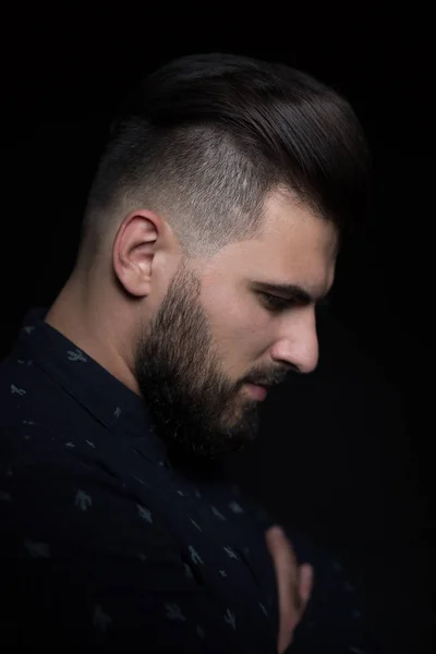 Young man on dark background — Stock Photo, Image