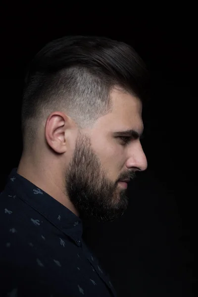 Young man on dark background — Stock Photo, Image