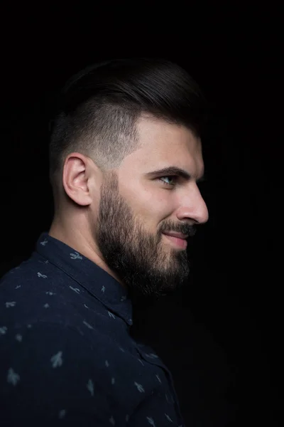 Young man on dark background — Stock Photo, Image