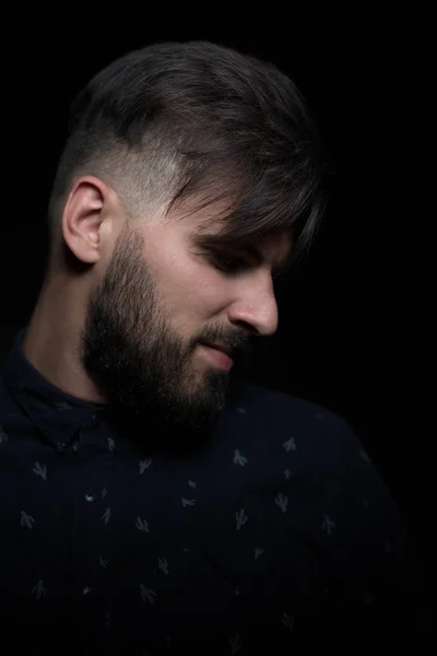 Young man on dark background — Stock Photo, Image