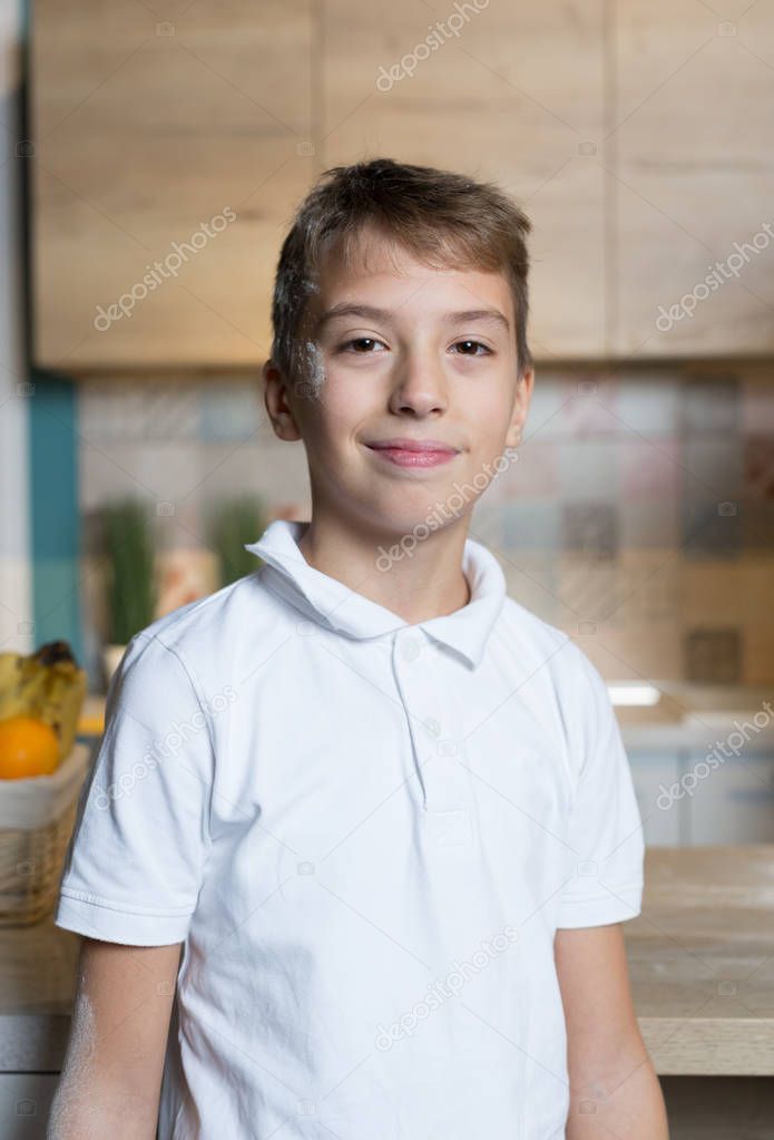 little boy in light kitchen