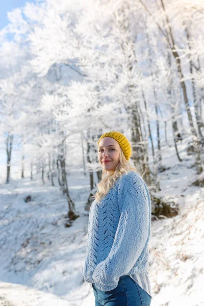 Beautiful young woman in winter