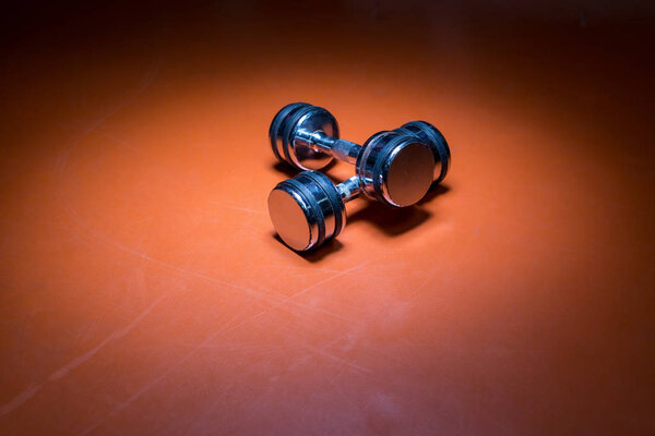 dumbells on gym floor