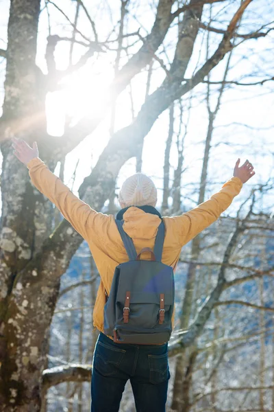 Young man with backpack in forest — Stock Photo, Image