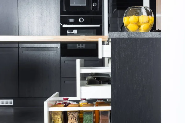 spices and groceries organized in a modern kitchen drawer