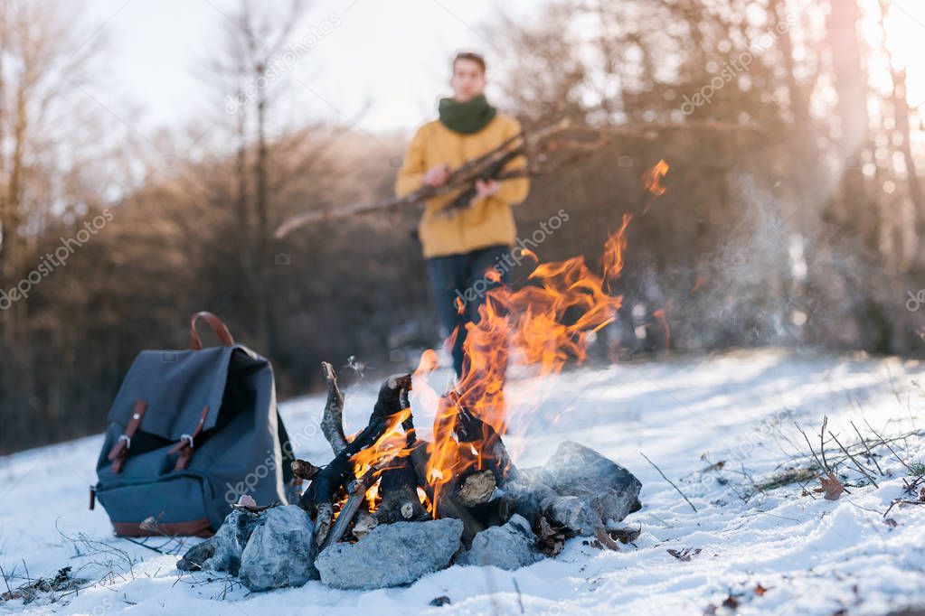 man near Bonfire on winter