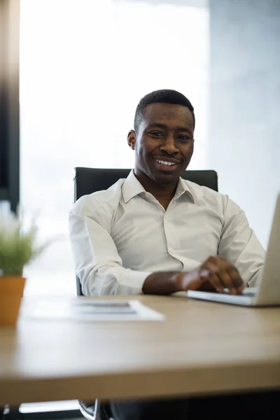 Young African American businessman in office — Stock Photo, Image