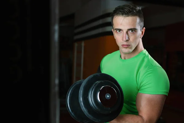 Young man in gym — Stock Photo, Image