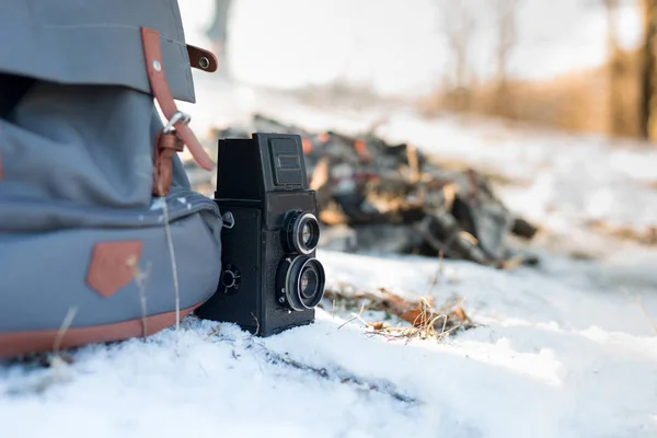 Hiking backpack and camera — Stock Photo, Image