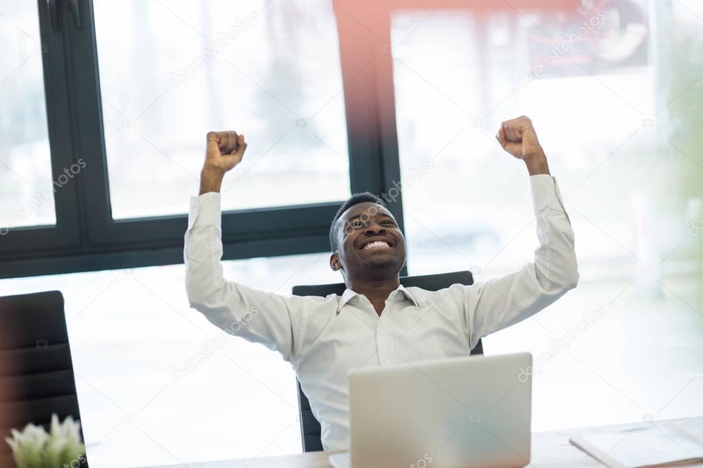 Young African American businessman in office