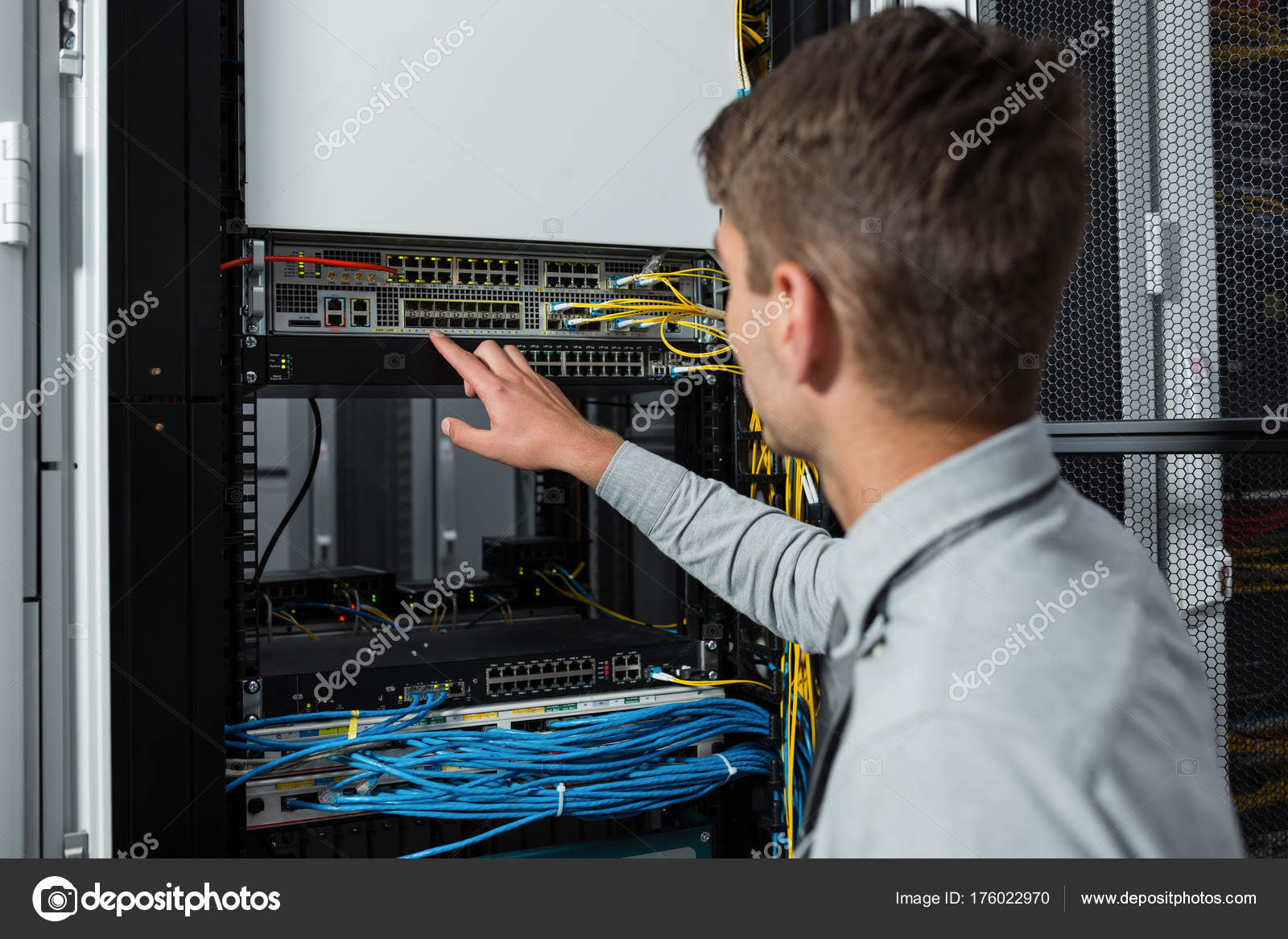 Young Man Standing Next Racks Computer Equipment Stock Photo by ...