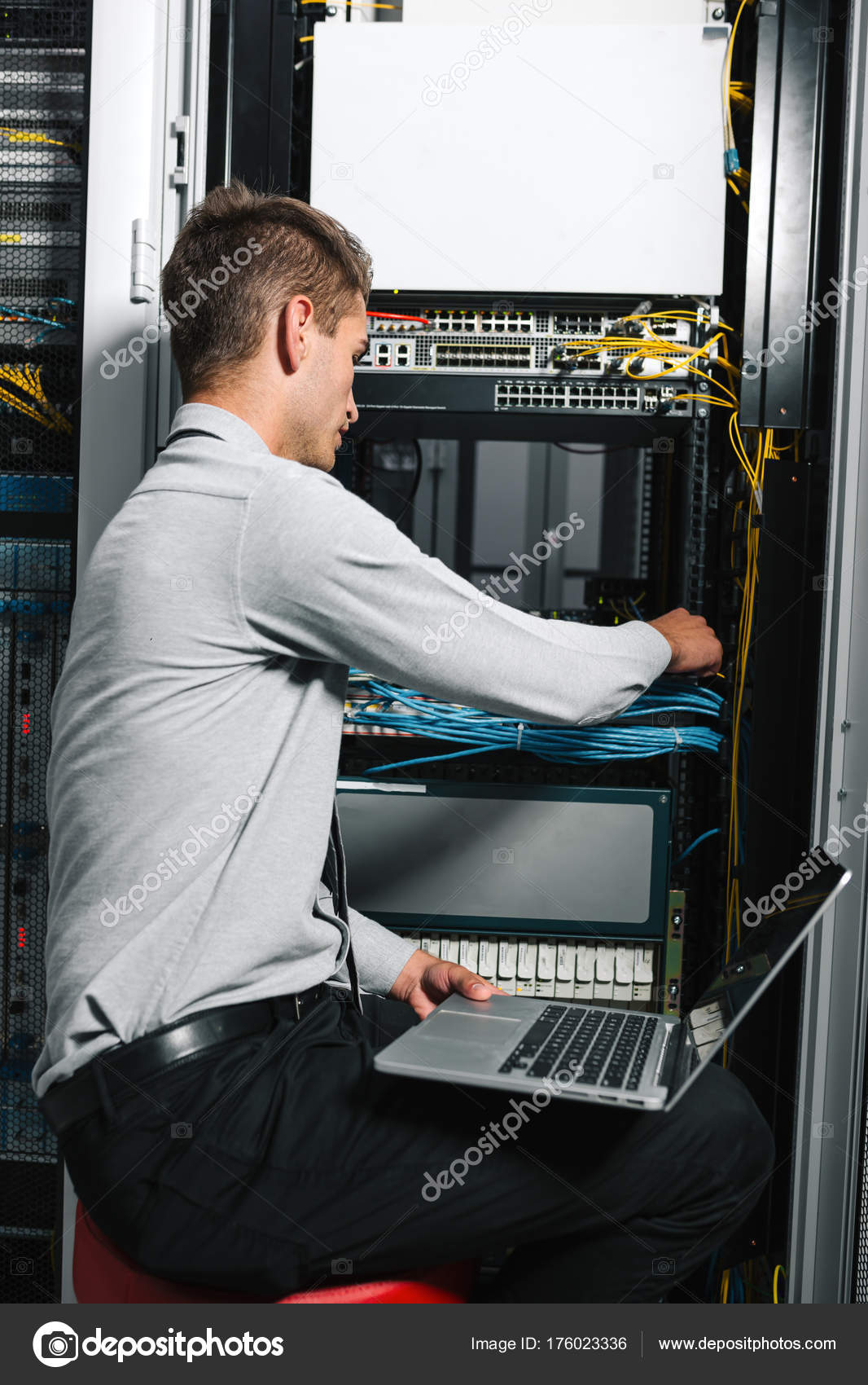 Young Man Standing Next Racks Computer Equipment Stock Photo by ...