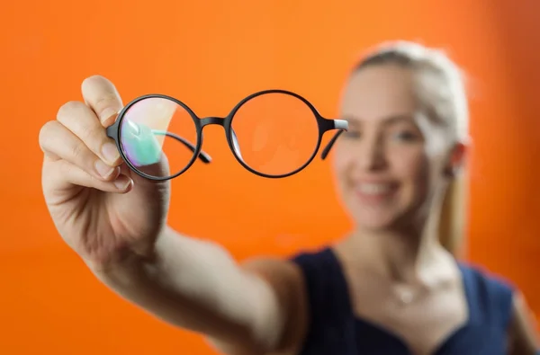 Woman Showing Glasses Close Camera Blurred Woman Background — Stock Photo, Image