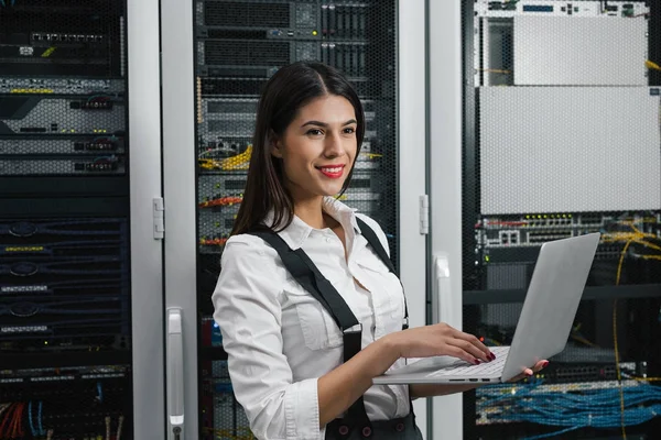 Portrait of a female executive in server room