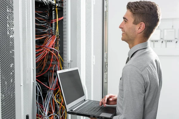 Portrait Modern Young Man Holding Laptop Standing Server Room Working — Stok Foto