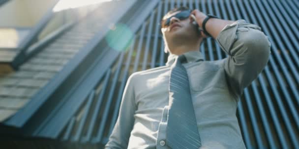 Young Man White Shirt Using Mobile Phone Front Office Building — Stock Video