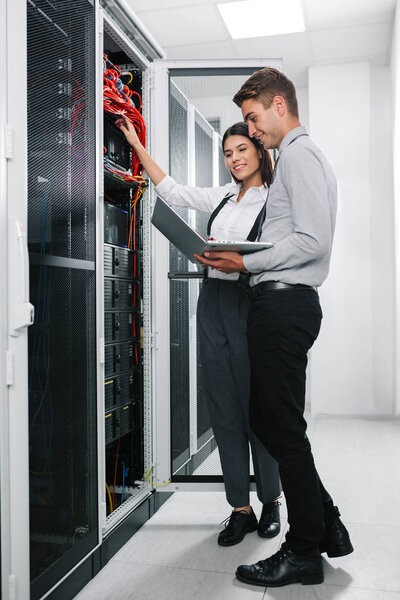 IT expert checking supercomputer server