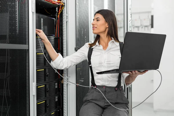 IT expert checking supercomputer server