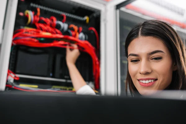 IT expert checking supercomputer server