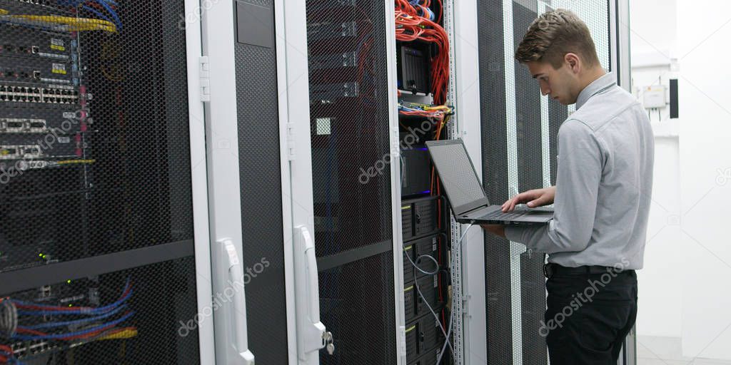 IT expert checking supercomputer server