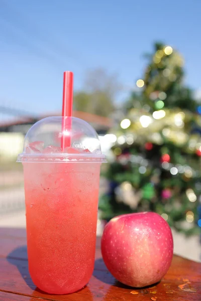 ice apple soda on table