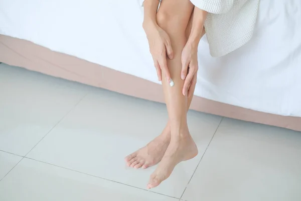 Woman applying legs cream,lotion , Hygiene skin body care concept.