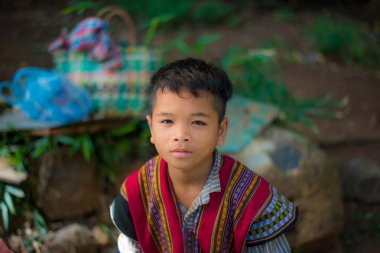 Portrait of a young Laotian boy in rural Laos. clipart