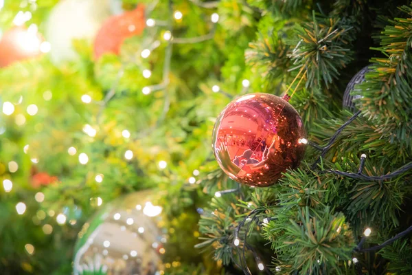 Gold Christmas background of de-focused lights with decorated tr — Stock Photo, Image