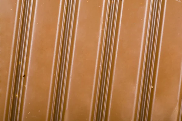 Mjölkchoklad med mandel bakgrund — Stockfoto