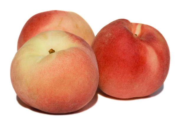 Tre färgglada persikor — Stockfoto