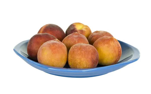 Acht perziken op plaat — Stockfoto