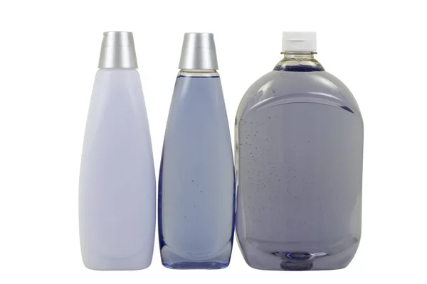 Tre flaskor med tvål, schampo och balsam — Stockfoto
