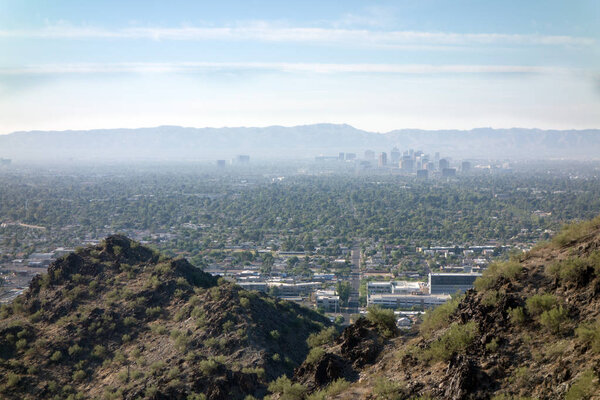 Arizona Valley of the Sun or Greater Phoenix Metro area as seen from North Mountain Park hiking trails on cool October morning